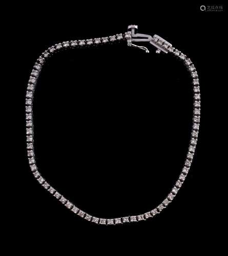 An 18 carat gold diamond tennis bracelet