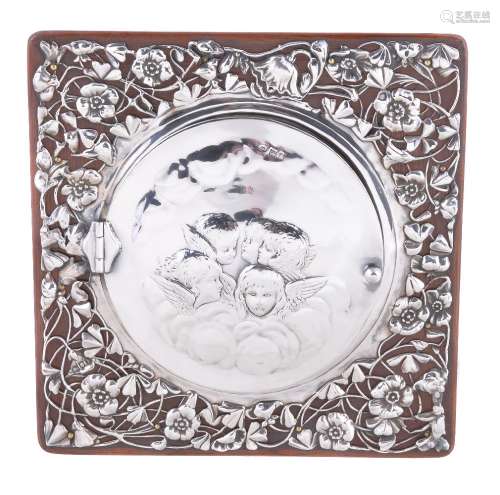 An Edwardian silver photograph frame by William Comyns & Sons