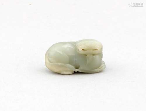 A small Chinese jade toggle in foo dog shape,