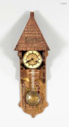 Swinging clock, circa 1890, wooden case with polychrome