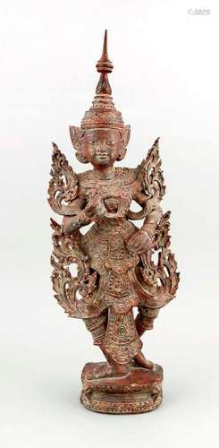 A tall carved-wood figure of a temple guard,