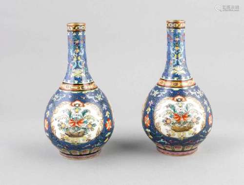 A pair of blue-grounded Famille-rose vases with floral