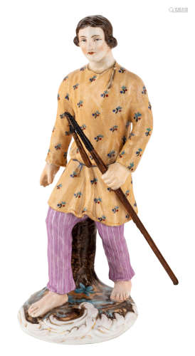 A RUSSIAN PORCELAIN FIGURE OF A YOUNG MAN WITH A WALKING STICK, POPOV PORCELAIN FACTORY 19TH CENTURY