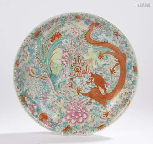 Japanese porcelain charger, the central field with depiction of a dragon and peacock amongst