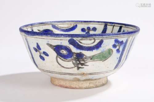 Persian design pottery bowl decorated in blue and green with a stylised portrait to the centre of