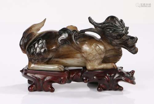 Japanese Meiji period Jade figure of growling Kirin, the figure with horns, scales at his legs and a