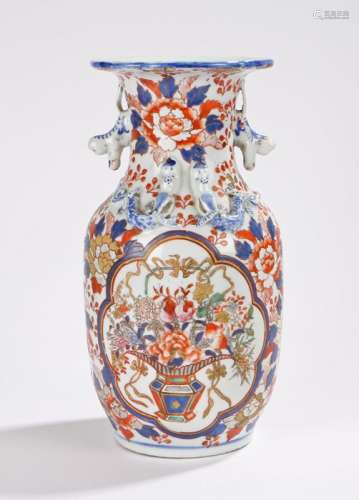 Japanese imari pattern vase, the wavy rim above two monkey form handles and raised dragon