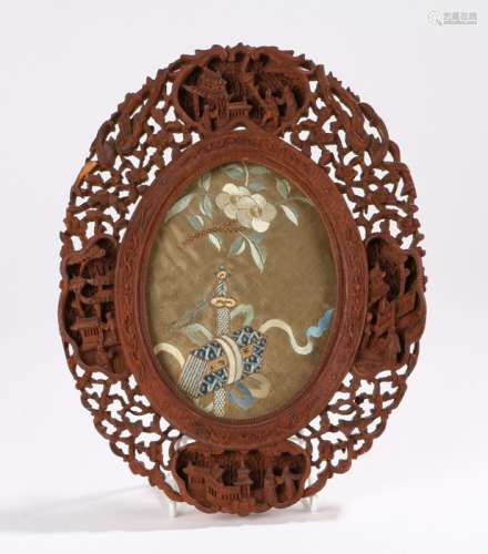 Late 19th Century Chinese Canton carved frame, carved with C scrolls, pagodas and figures, with an