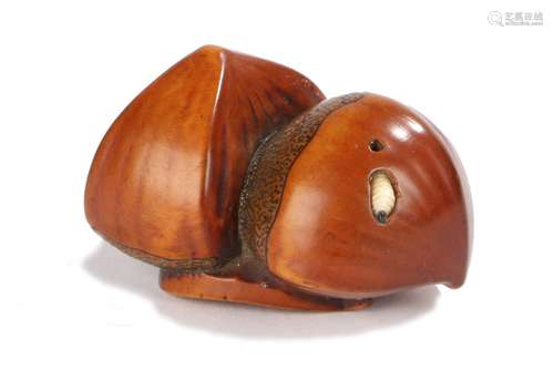 Japanese Edo period netsuke, the wooden Netsuke depicting three chestnuts, one chestnut has a maggot