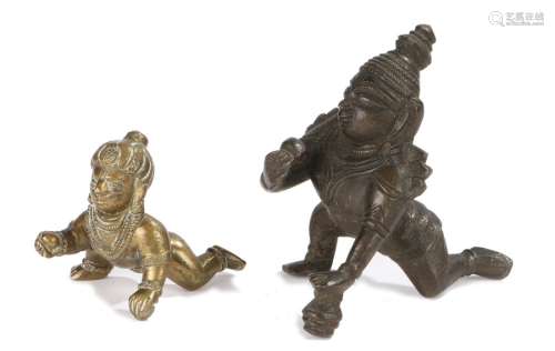 Two 20th Century Indian figures of the God Krishna as a crawling baby with a ball of butter, one