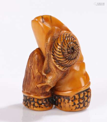 Japanese Meiji period ivory netsuke, of a snail crawling on bamboo, 4.2cm high