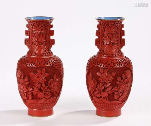 Pair of Cinnabar lacquer vases decorated with panels of flowers, with blue interiors and gilt