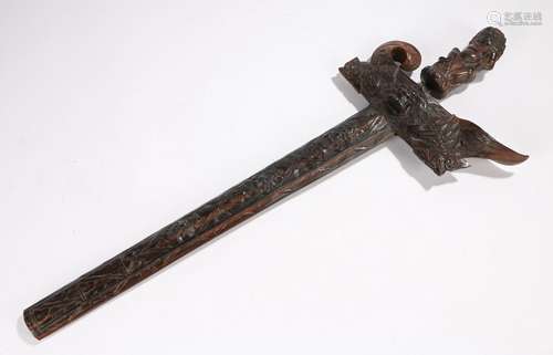 Balinese kris or keris the wavy edged blade with inlaid design, leading to carved grip in the form