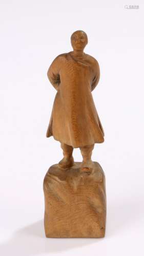 Republic of China carved figure, of a man walking raised on a rocky plinth base, 9.5cm high