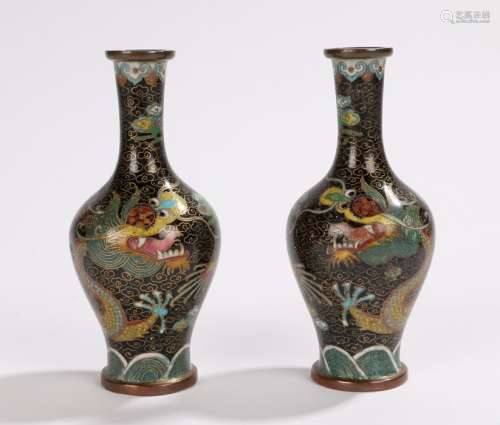 Pair of Chinese cloisonne miniature vases, with black grounds and swirling dragons, 11cm high, (2)