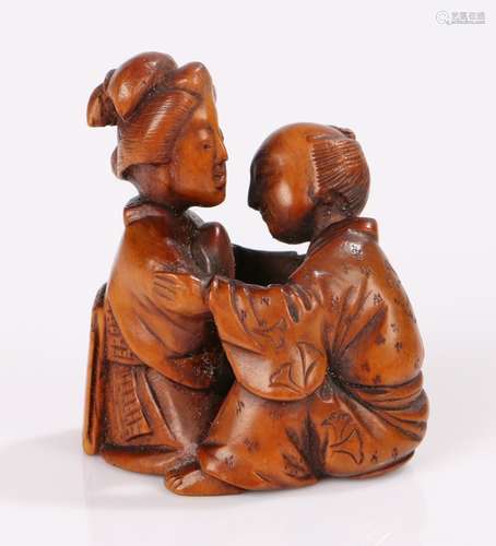 Japanese Meiji period netsuke, the boxwood netsuke as a Shunga carving of a couple in intimate