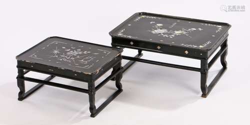 Nest of two Chinese black lacquer occasional tables, with foliate and butterfly inlaid mother of