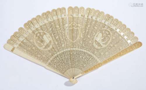 Early 19th Century Canton ivory lace-work fan,the sticks finely carved overall with twining leaves