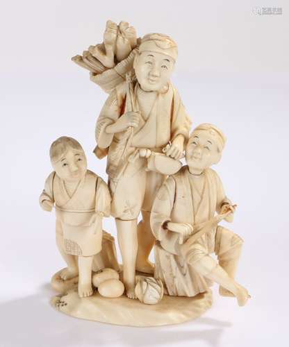 Japanese ivory Okimono, the sectional group carved as a central figure gathering wood, flanked by