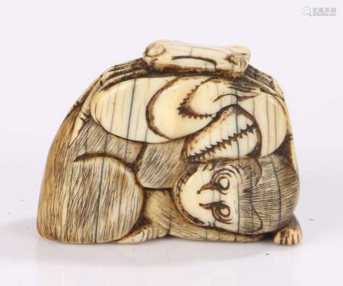 Japanese Meiji period netsuke, the ivory netsuke carved as a monkey with a hermit crab on it's back,