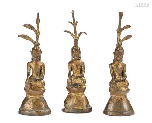 Three Buddhas of gilded bronze seated in the dhyanasana pose possibly Thailand, 11cm high (3)