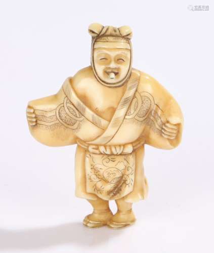 Japanese Meiji period netsuke, carved as a figure with a protruding tongue, 4.7cm high