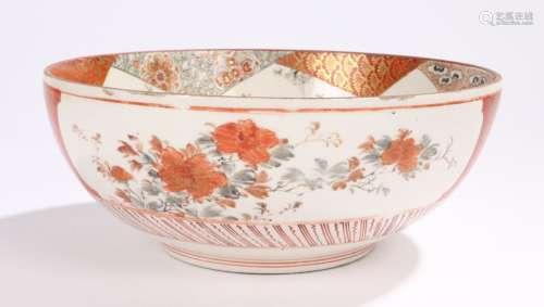 Japanese porcelain bowl, decorated with landscape scenes, birds and foliage in reds and oranges,