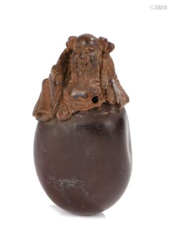 Japanese Meiji period netsuke, the netsuke a carved nut with a Chinese sage emerging from the