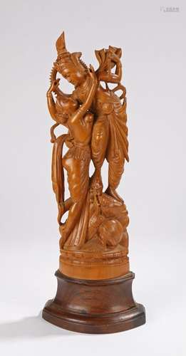 Balinese carved figural group, with two figures standing on a plinth base with gushing water from