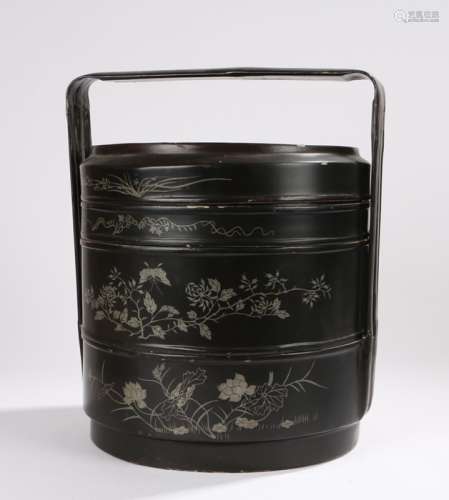 Japanese lacquered tiered basket, with an arched handle above the three containers decorated with
