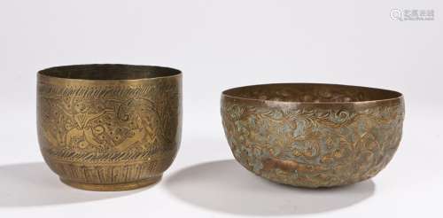 Two 19th Century Indian brass bowls, the first decorated with tigers hunting among foliate