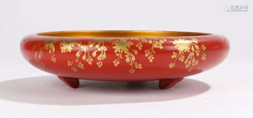 Japanese Meiji period lacquered shallow bowl, with a gilt interior and red exterior heighted with