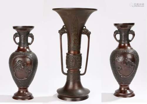 Chinese bronze vase, with mask cast handles, the body with flared rim and waisted body on an out-