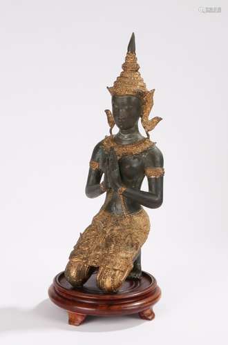 Thai bronze figure depicting a kneeling deity wearing an elaborate gilt headdress, on a non-