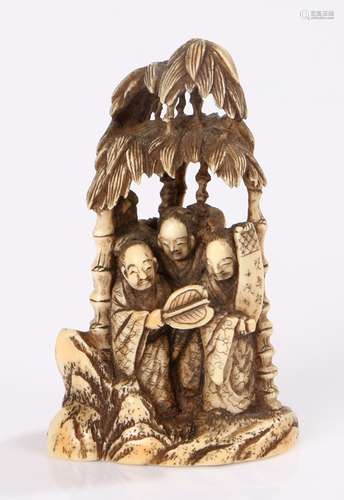 Japanese Meiji period okimno, the ivory okimono carved as a group of scholars sheltering under a