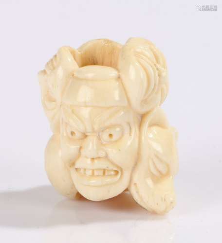 Japanese Meiji period ivory ojime bead, carved as theatrical masks, signed, 3cm high