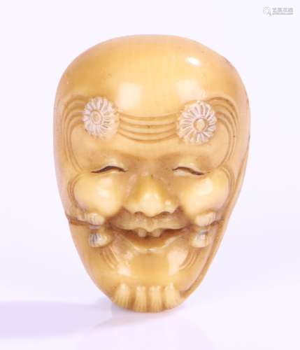 Japanese ivory noh mask netsuke, the mask with flower heads to the forehead, 3.5cm high