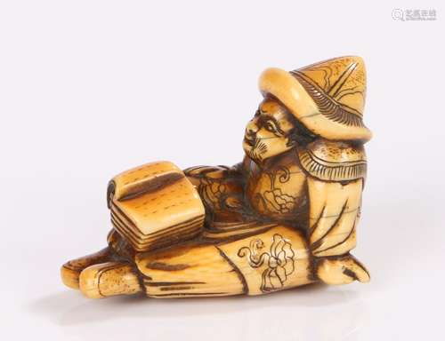 Japanese Edo period netsuke, the netsuke carved as a seated Dutchman wearing a hat and with an