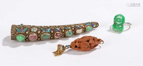 Chinese jewellery, to include a jade set white metal banded ring, a carved bead in the form of a