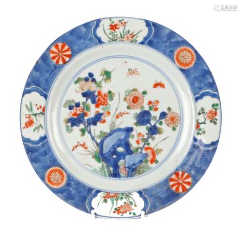Kangxi Chinese plate, the plate in Imari palette of flowers issuing from rockwork, the border