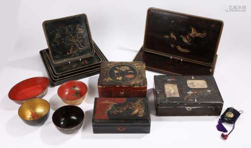 Lacquered items to include a set of five graduated trays, two other trays, three boxes and covers,