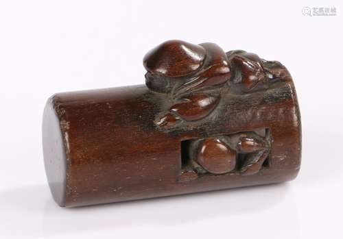 Japanese Edo period netsuke, the boxwood cylinder netsuke with hollow interior and a figure crawling