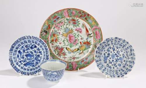 Chinese tea bowl and two saucers decorated with flowers and foliage, one saucer and tea bowl with