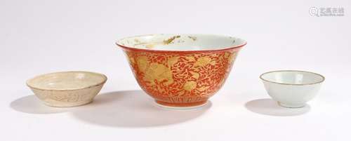 Three Chinese dishes to include a small Dingyao exterior moulded saucer dish possibly Jin dynasty,