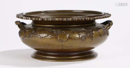 Japanese bronze bowl, the pierced insect and flower head cast border above a fruiting vine frieze