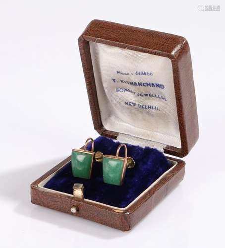 Pair of early 20th Century jade earrings, with tapering jade panels to yellow metal, housed within