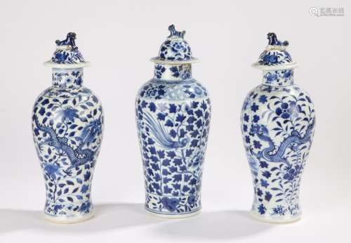 Three Chinese late Ch'ing baluster shape lidded vases two decorated with dragons and another with