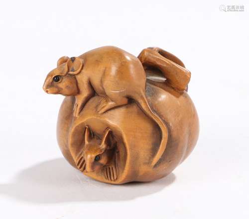 Japanese wood carved netsuke, carved with two mice in and on a piece of fruit, signed to the base,