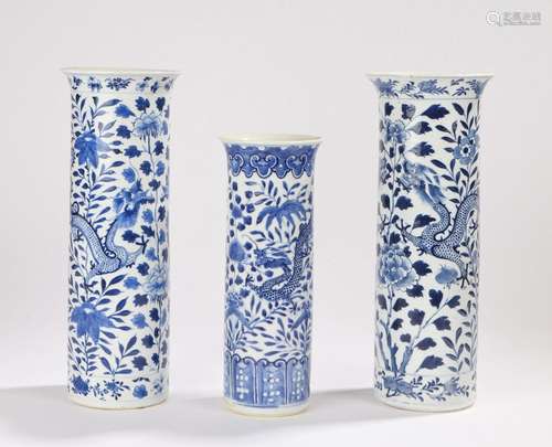 Three Chinese late Ch'ing tall cylindrical vases decorated with dragons foliage and flowers, four