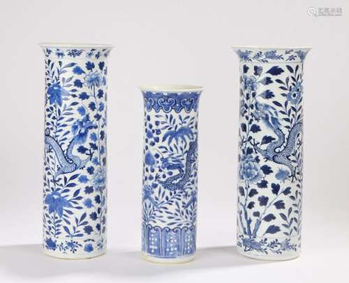Three Chinese late Ch'ing tall cylindrical vases decorated with dragons foliage and flowers, four